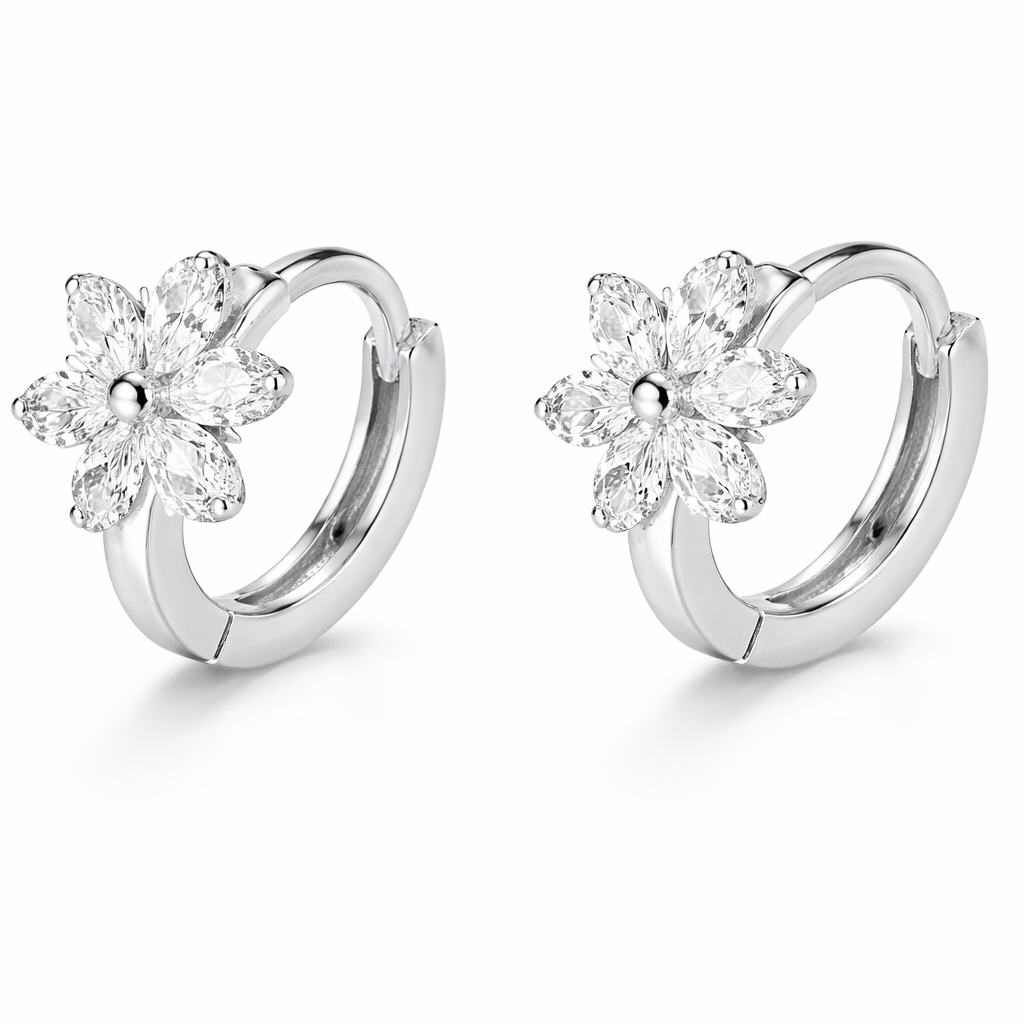 Silver hoop earrings with floral designs on a white background