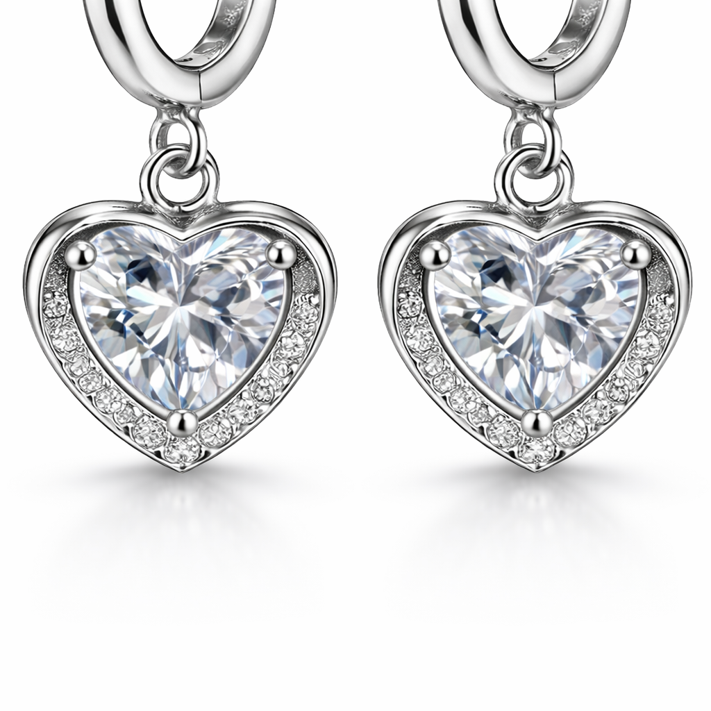A close up shot of the zirconia stone inside the heart drop pendant of the silver hoops earrings.