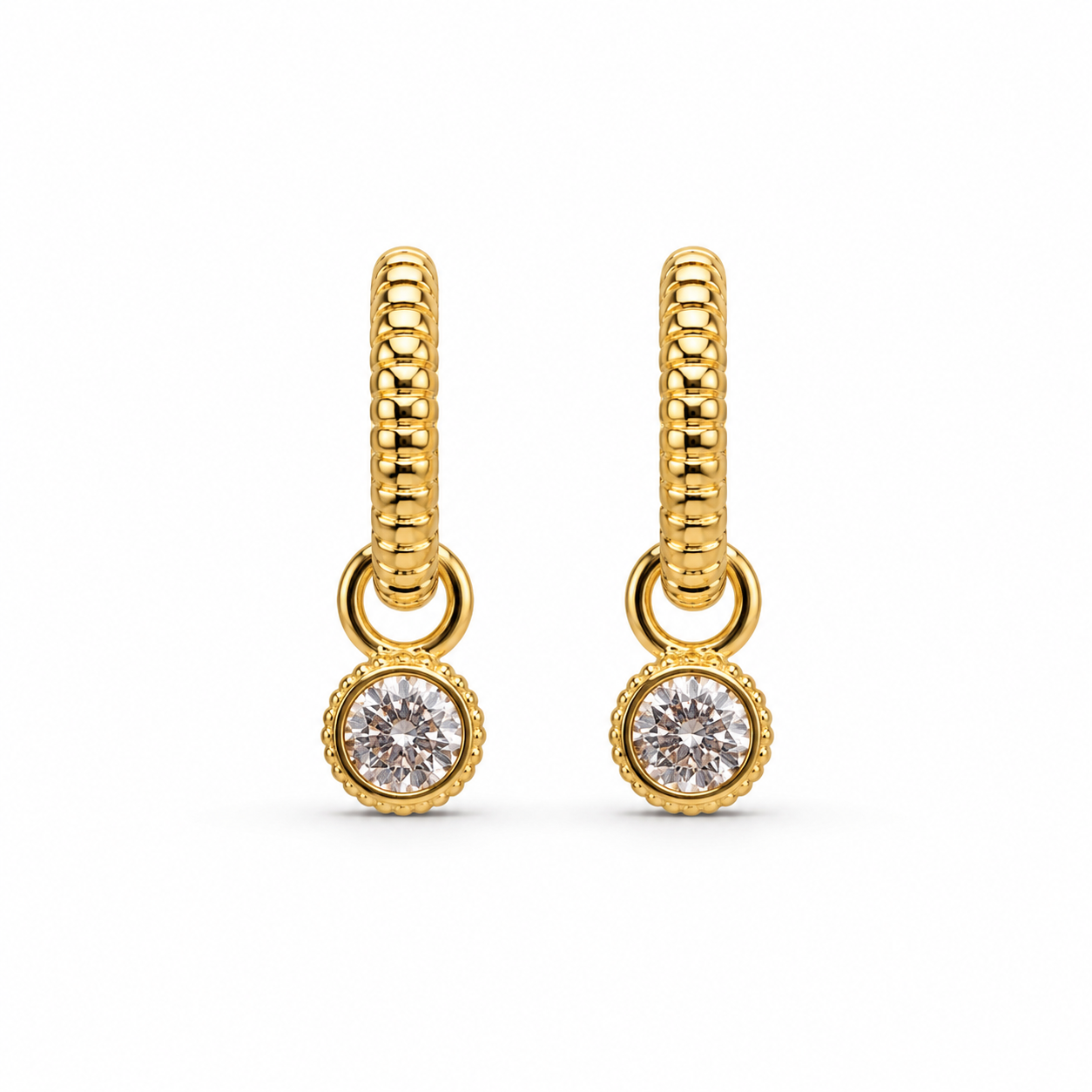 Gold hoop earrings with diamond drops on a white background
