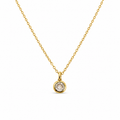 Gold necklace with a round diamond pendant on a white background